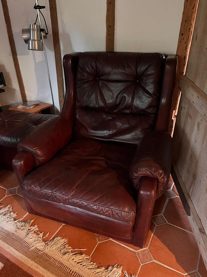 Two Leather Arm Chairs And Footstool. Set Of Three